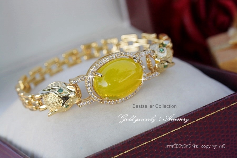 ข้อมือหัวสิงห์ สินค้านำเข้า ดีไซด์เก๋ล้ำหน้า สีเหลืองอำพันสะดุดตา