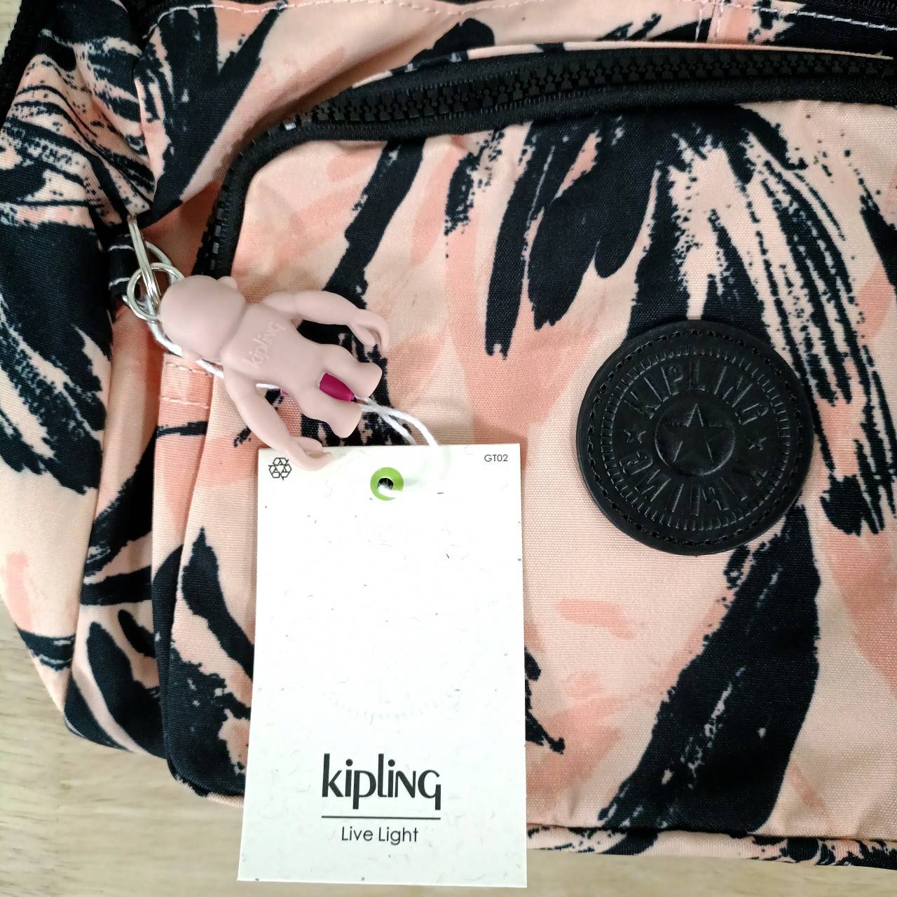 กระเป๋าสะพายแบรนด์เนมคิปลิงค์ใส่ของได้เยอะสึชมพูโอรสลายใบไม้กันน้ำได้ KIPLING RETH CROSSBODY BAG